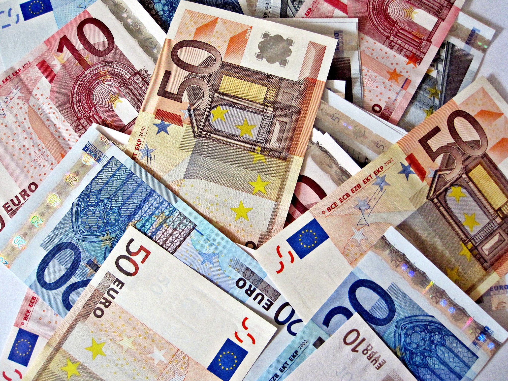 "Pile of Euro Notes" by Images_of_Money is licensed under CC BY 2.0.