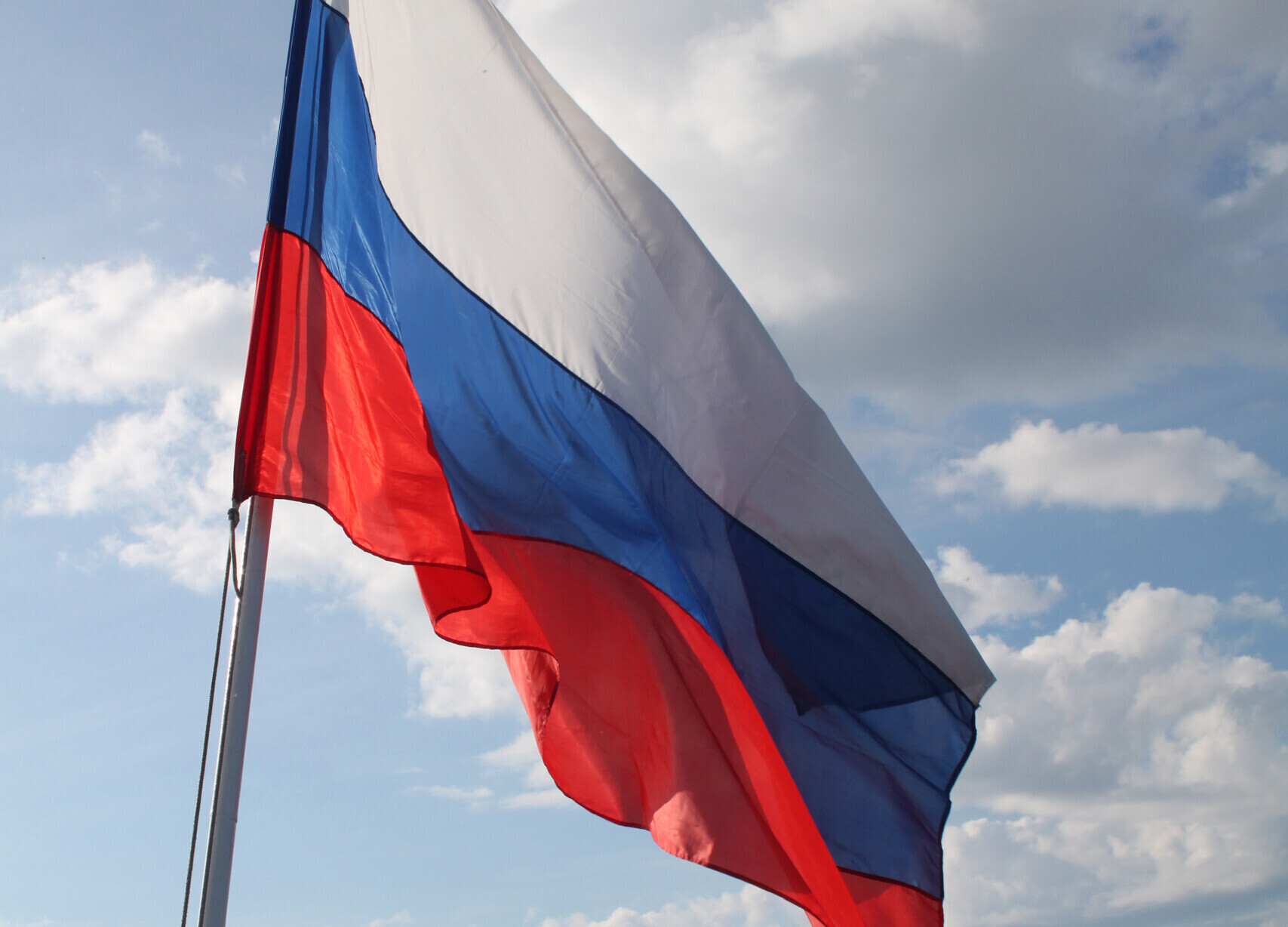 "Russian flag flying on board boat on the Volga River" by flowcomm is licensed under CC BY 2.0.