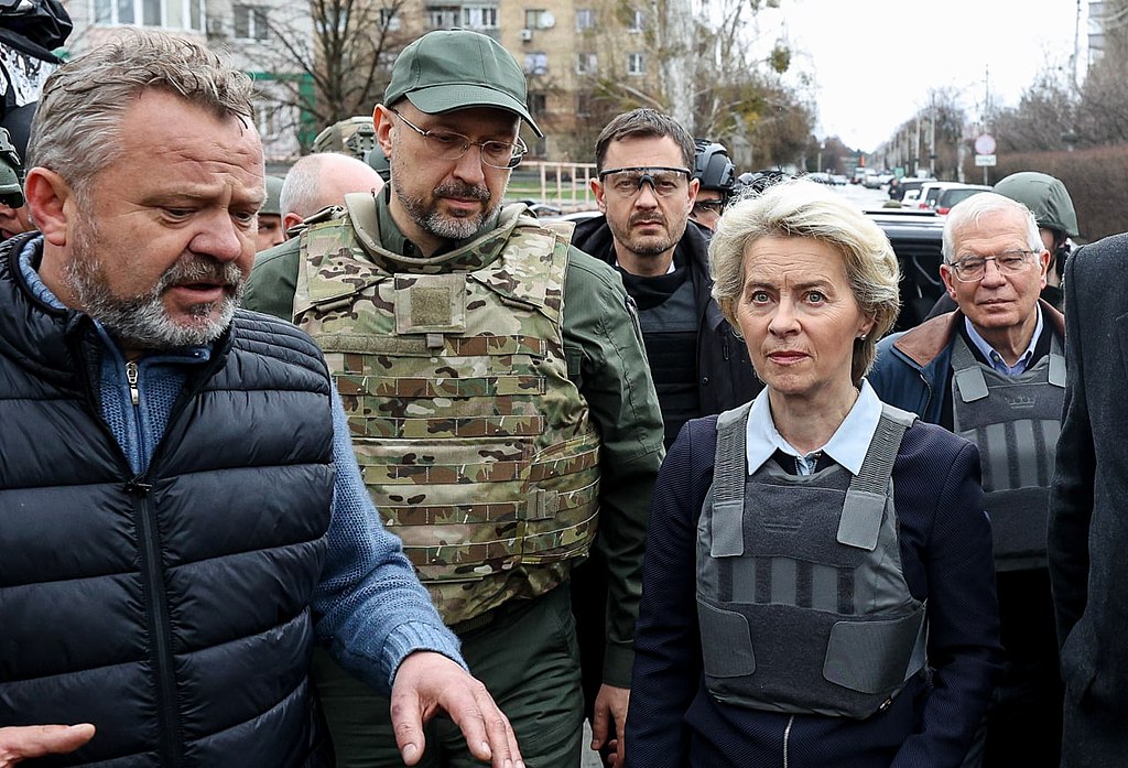 "Denys Shmyhal, EU officials and Eduard Heger visited Bucha after the massacre (2)" by Cabinet of Ministers of Ukraine is licensed under CC BY 4.0.
